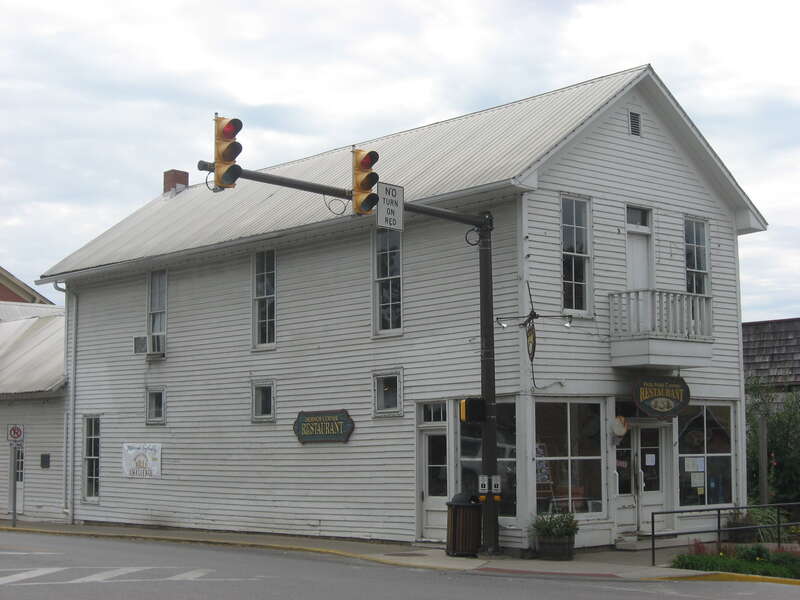 Front and eastern side of the F.P. Taggart Store, located on the southwestern corner of the intersection of Van Buren (State Road 135) and Main Streets in downtown Nashville, Indiana, United States.  Built in 1870 and now a restaurant, it is listed