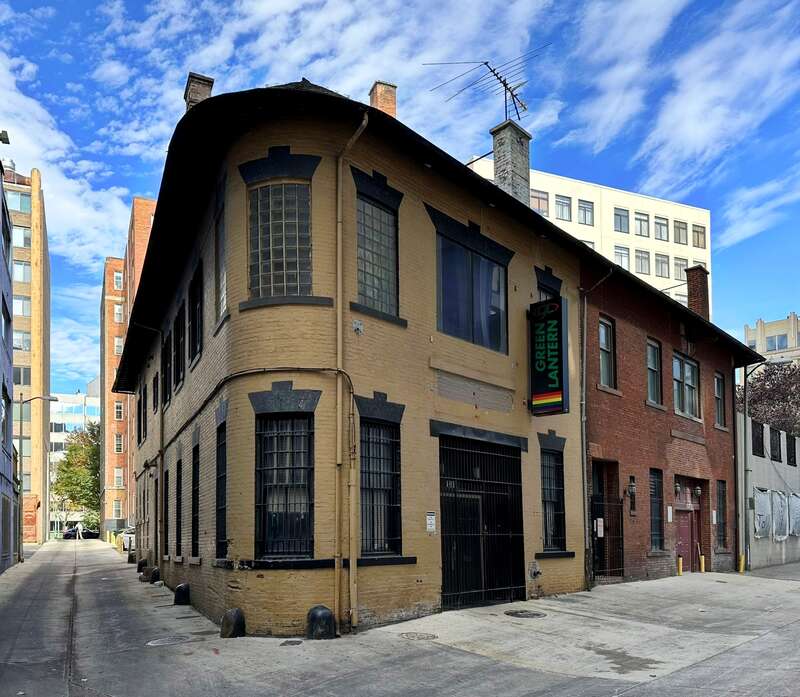 The building located at 1335 Green Court NW in Washington, D.C., is home to the Green Lantern, a gay bar. Previous occupants include printing company Murray &amp;amp; Heister Inc., Sam Harris Associates, Roy Littlejohn Associates Inc, and Garvin's Comedy