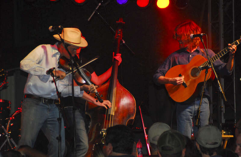 Ketch Secor (fiddle), Morgan Jahnig (stand-up bass), and Willie Watson (guitar) of Old Crow Medicine Show at City Stages in Birmingham, Alabama on June 13, 2008.