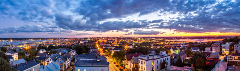 This is a five image panorama of images taken earlier this evening from the Portland Observatory.  On the left is the harbor and on the right  Back Cove.  The latter is a shallow basin connected to the sea.

The Portland Observatory is a wooden,