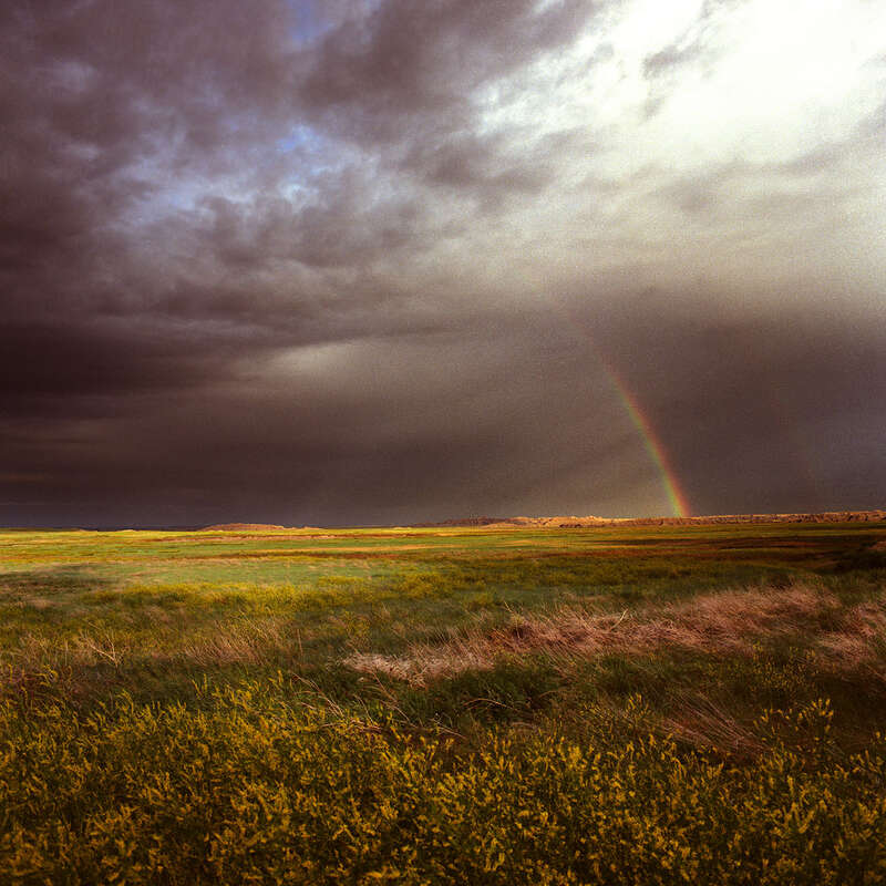 500px provided description: Rainbow over the Badlands N.P. - South Dakota [#rainbow ,#rain ,#south dakota ,#Badlands N.P.]