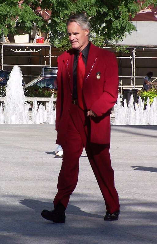 An anonymous man wearing a red suit in Chicago's Daley Plaza, in the year 2012.