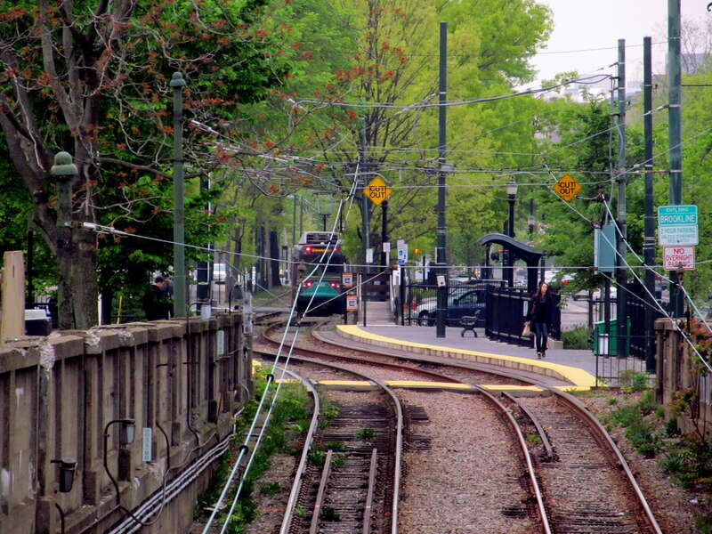 An outbound train leaves St. Marys Street station in May 2012. The walls of the St. Marys Street Portal are visible in the foreground.