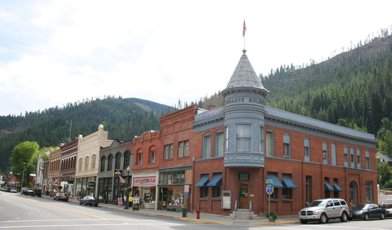 Intersection of Sixth and Bank Streets in Wallace, Idaho, United States.  The buildings pictured are part of the Wallace Historic District, which is listed on the National Register of Historic Places.