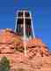 The Chapel of the Holy Cross is a Roman Catholic chapel built from 1954 to 1956 into the red rock buttes of Sedona, Arizona, within the Coconino National Forest. It was inspired and commissioned by local rancher and sculptor Marguerite Brunswig