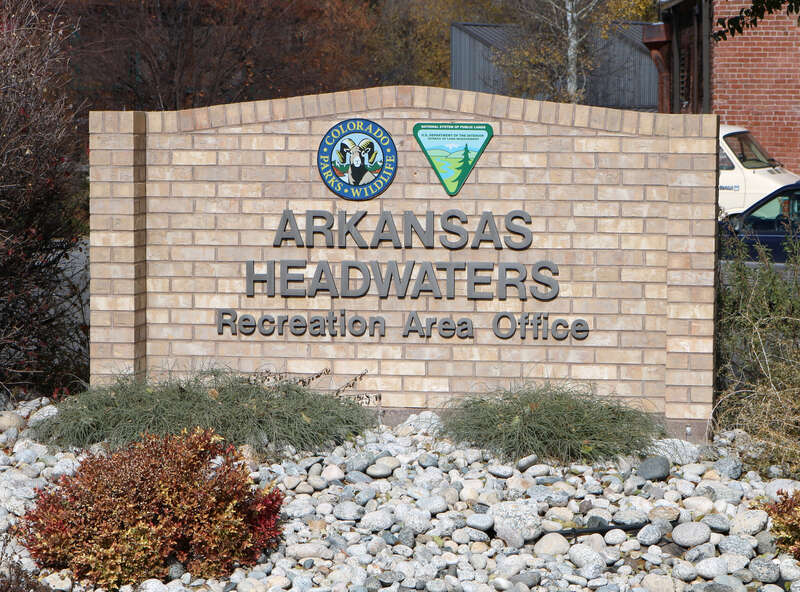 A sign for the Arkansas Headwaters Recreation Area Office, located at 307 West Sackett Avenue in Salida, Colorado.