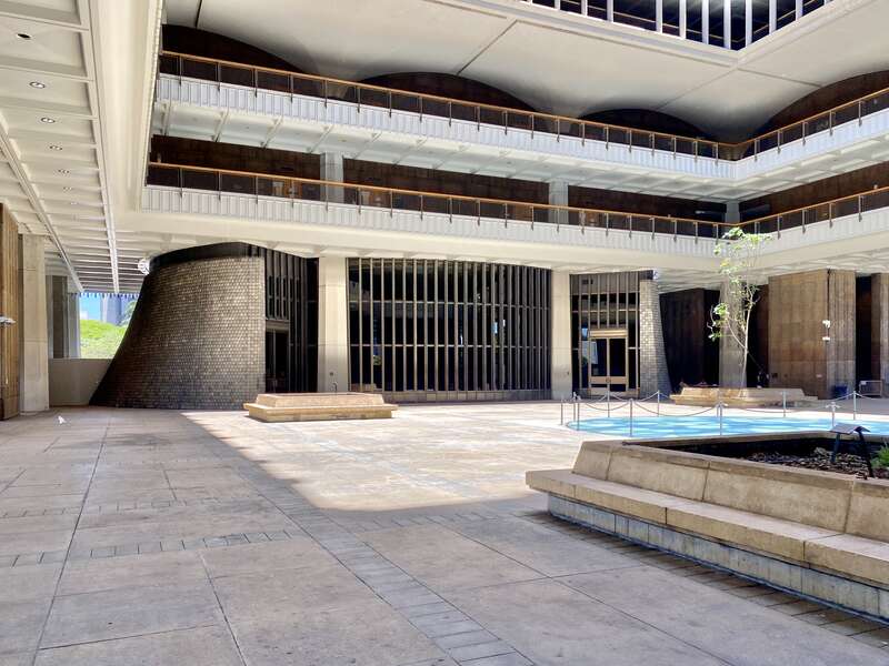 Built between 1965 and 1969, this modernist State Capitol building was designed by Belt, Lemon and Lo of Architects Hawaii Ltd., and John Carl Warnecke and Associates.  The building was built in a variant of Modernism known as the “Hawaiian