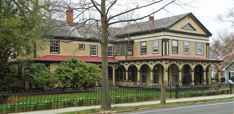 The Clark Greenman House at 75 Greenmanville Avenue in Mystic, Connecticut was built in 1841 in the Greek Revival style for Clark Greenman, the second oldest of three brothers who founded the George Greenman &amp;amp; Co. shipyard. The porches with their