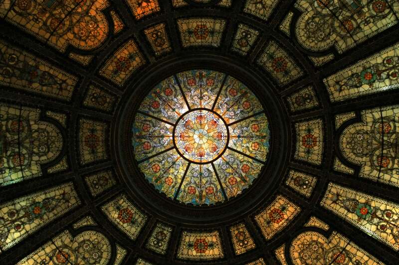 The 40-foot-diameter stained-glass dome in shades of tan, beige, and ochre is now lighted electrically. It was originally illuminated by sunlight. The stained glass was made by Healy &amp;amp; Millet of Chicago. It is held by cast-iron ribbing,