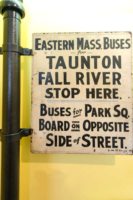 An Eastern Massachusetts Street Railway bus stop sign at Seashore Trolley Museum, photographed in May 2012. Based on the listed destinations, this appears to have been a southbound stop between Brockton and Taunton, likely on what is now Route 138.