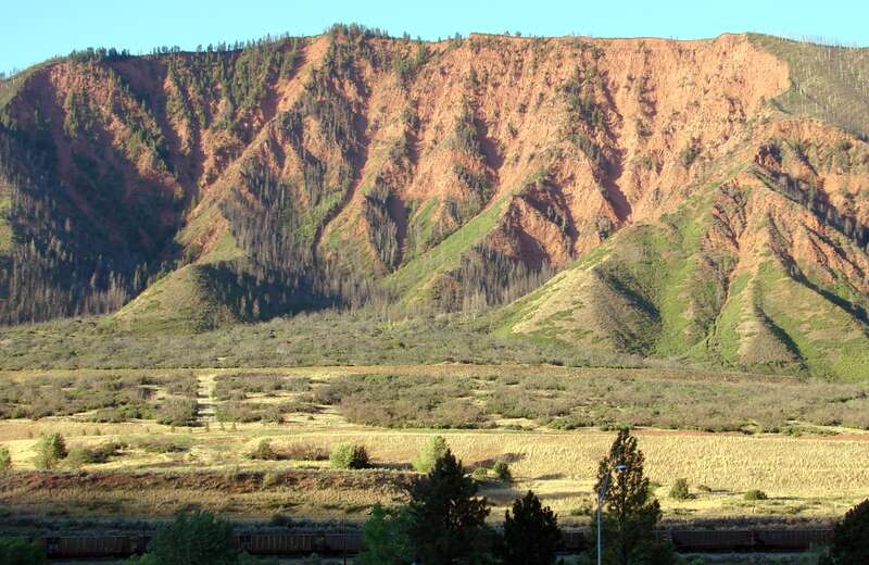 (1 in a multiple picture set)
This shot was taken from the front porch of our motel room on the north side of I-70.  On the other side of the highway the Colorado River flowed (just out of the picture at bottom).  The mountain rises up dramatically