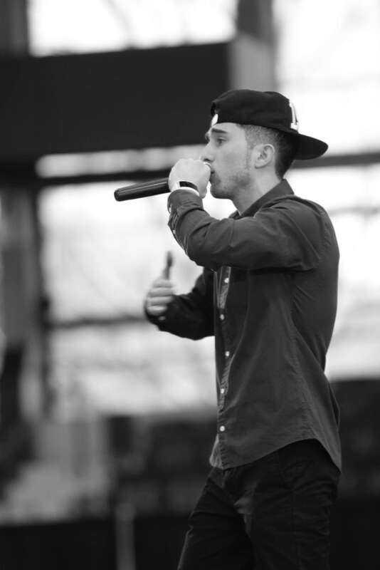 This art work represents American rapper Grisha Consta. He was performing four songs from his LP &quot;IMMIGRANT&quot; at Dorton Arena Raleigh, North Carolina. They are: Nation Of Immigrants, Best Time, My Real Homiez, Dear Mama.