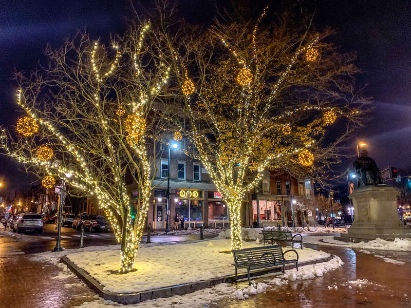 Longfellow Square, Portland Maine decorated for Christmas. Statue of Longfellow to the right.