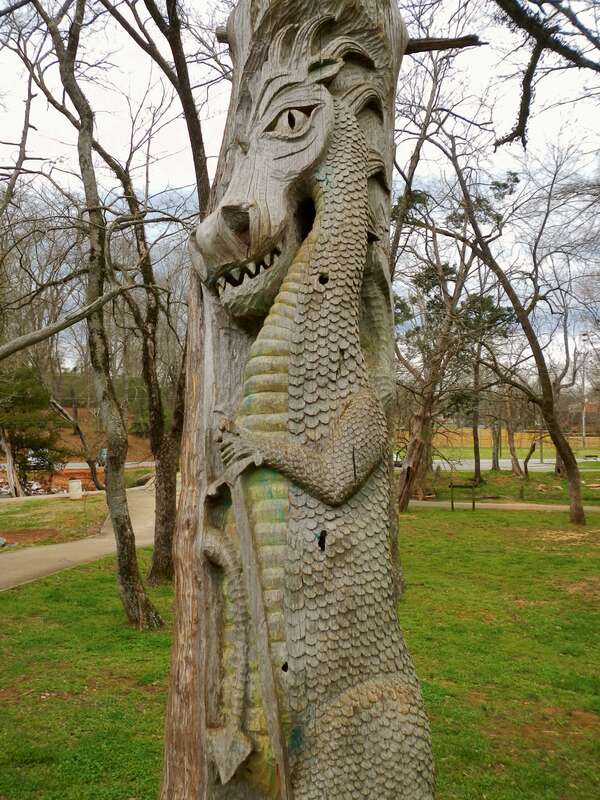 This is a photograph of a wood carving by Tim Tingle in Orr Park in Montevallo, Alabama.