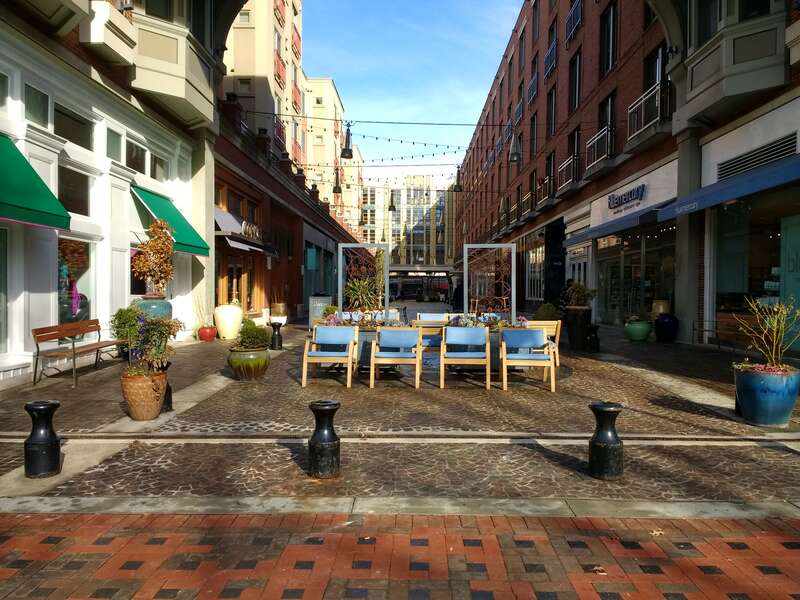 Stores and chairs in a small pedestrian area in Bethesda, Maryland.