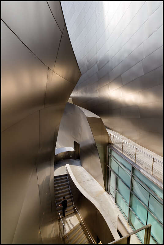 It is great fun to shoot inside the Walt Disney hall building. Lots of interesting shapes and light everywhere.
ISO 100, 10mm, f7.1, 1/640.

Increased constrast using curves, protecting upper right corner with a gradeint mask. Used Nik Viveza to