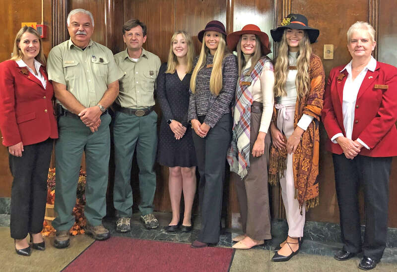 From left, Director of the Queens Department Melanie Dempsey, Monongahela National Forest Deputy Forest Supervisor Ray Torres, Forest Supervisor Shawn Cochran, Forest Princess Jessica Stevens, Maid Silvia Kaitlin Smith, Maids of Honor Christine