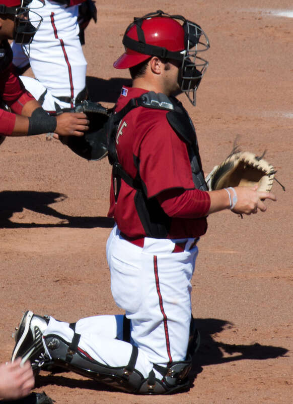 Arizona Diamondbacks catchers, including Miguel Montero, Konrad Schmidt and P. J. Pilittere, catch bullpen sessions during spring training in February 2011.