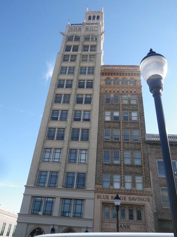 The Jackson Building on Pack Square in Asheville, NC, was the first skyscraper in Western North Carolina, it was built in 1924.  Today, it shares the skyline with several newer skyscrapers and the mountains.