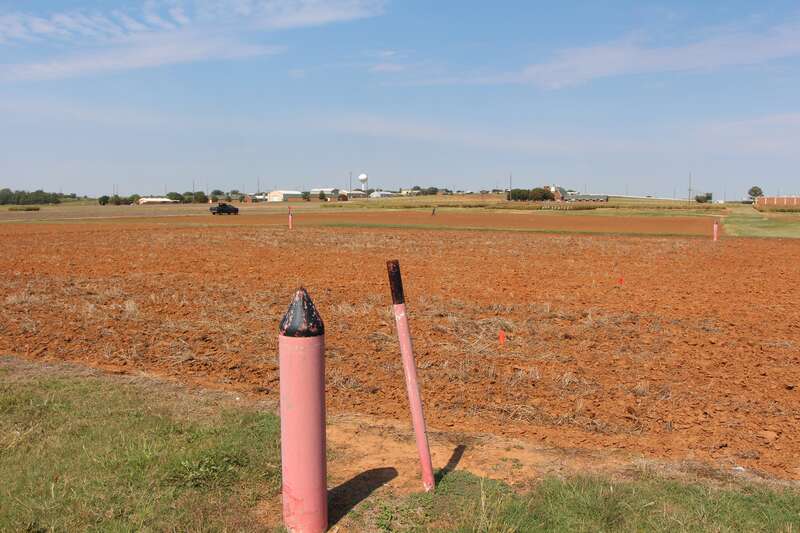 Magruder Plots, Oklahoma State University–Stillwater.  Boundaries identified by pink posts; unfertilized &quot;check&quot; plot visible with less stubble.