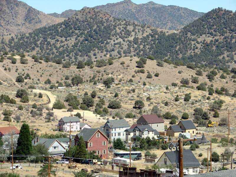 (1 in a 17-picture set)
There are few of the original homes left. Many others were hastily built and were not strong enough to hold up over the years.  The cemetery in the background is Catholic.  The general cemetery (Masonic) is north and above it.