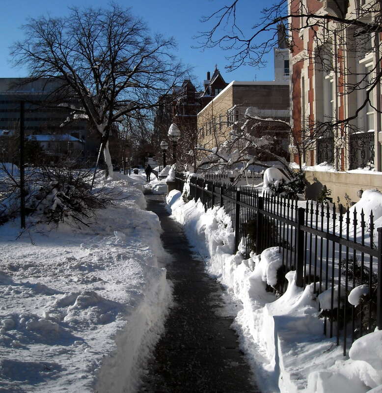 A pile of broken tree limbs, (following the Second North American blizzard of 2010) lying in front of the Thomas T. Gaff House, on the sidewalk of 20th Street, N.W., in the Dupont Circle neighborhood of Washington, D.C..