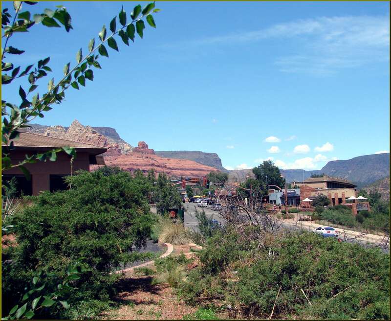 (1 in a multiple pictures set)
I was sitting on a patio sipping a cold drink when I took this picture looking north at the shopping districk in Sedona, AZ.