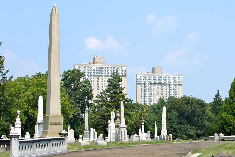 Woodlands Cemetery (a NHL and on the NRHPs), looking east to University of Pennsylvania medical buildings. The obelisk of Dr. John Kidd Lee, a prominent physician in West Philadelphia is visible in the midground. [1][2]
