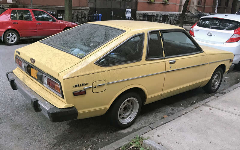 A 1979 Datsun 210 Coupé (hatchback) in Brooklyn's Williamsburg neighborhood.