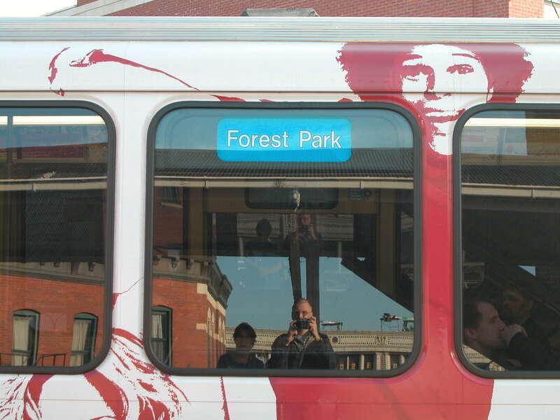 20030524 88 Jackie &amp;amp; David reflected in CTA Blue Line L