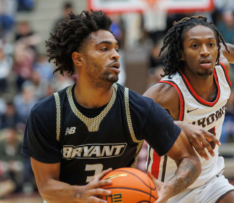 Bryant's Sherif Gross-Bullock and Brown's Lyndel Erold. Bryant Bulldogs at Brown Bears mens basketball. Dec 1, 2023.