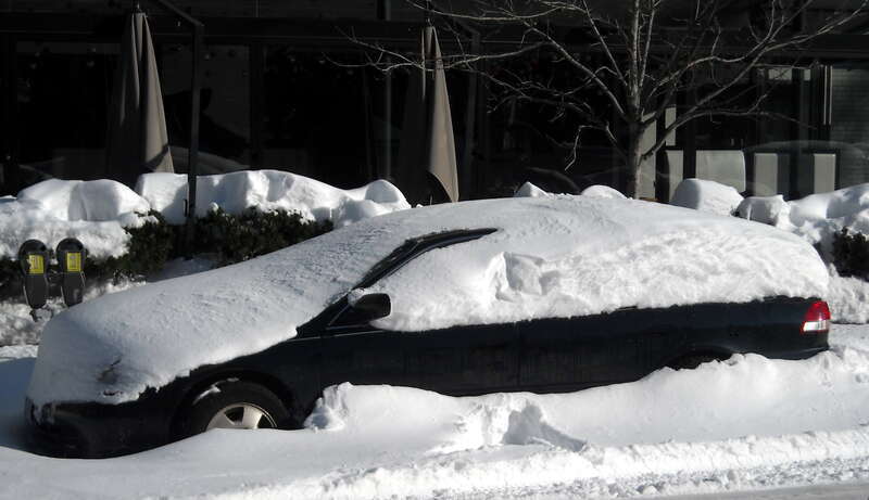 An automobile covered with snow in the Dupont Circle neighborhood of Washington, D.C., following the North American blizzard of 2009.