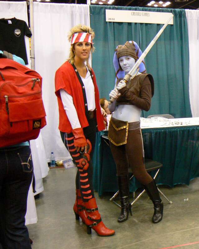 Okay, so I recognize a Twi'lek when I see one, but what is the woman in red dressed up as?