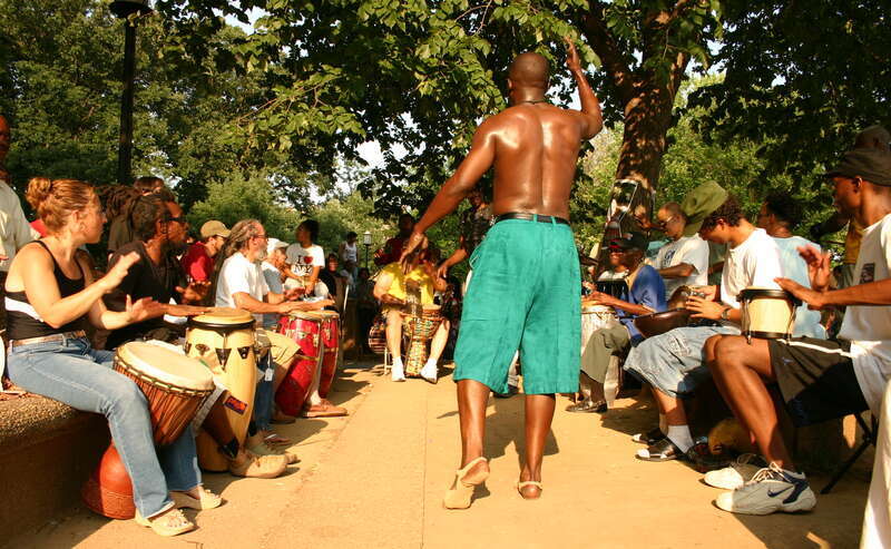 A man dances during a drum circle taking place at Meridian Hill Park, a National Historic Landmark located in the Columbia Heights neighborhood of Washington, D.C.