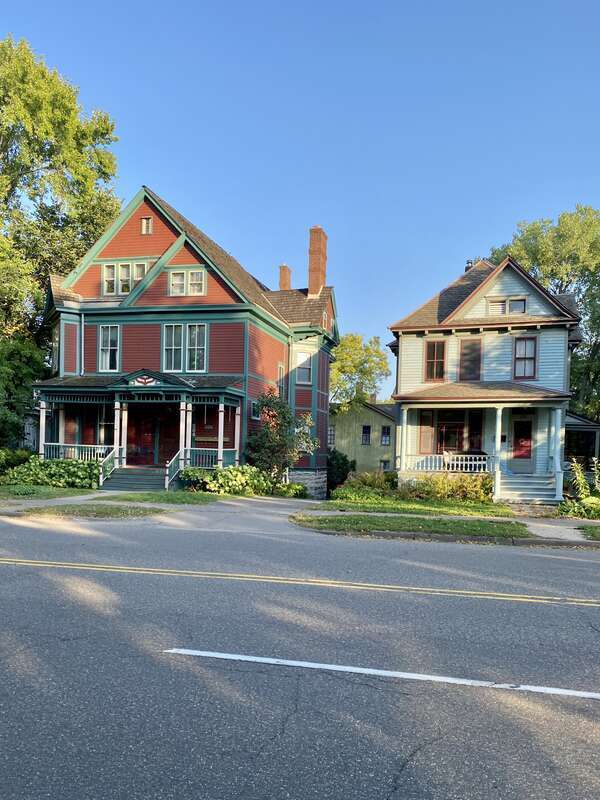 The Knox-Austin House, on the left, was built in 1885 and was designed in the Queen Anne style by James Knox Taylor.  The house was once home to Horace Austin, former governor of Minnesota (1870-1874).  The house on the right was built circa 1905 in