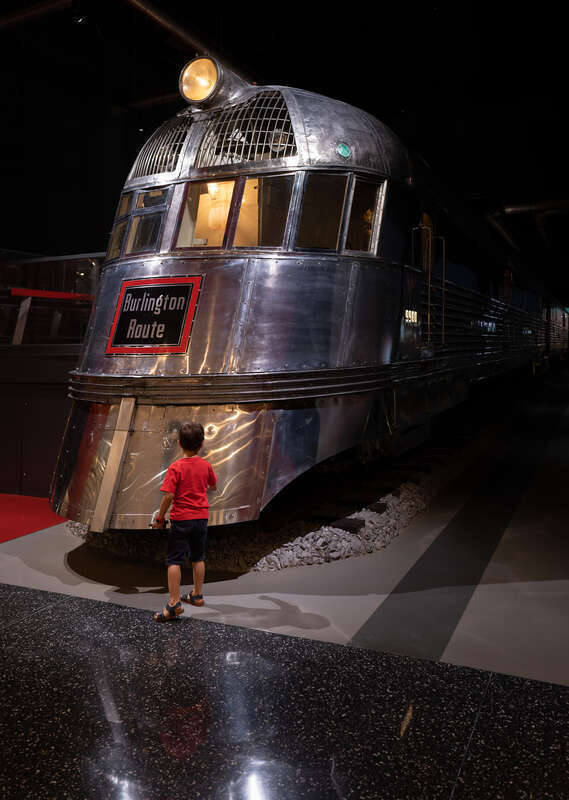 Gabriel in front of the Pioneer Zephyr train, Museum of Science and Industry, Chicago, Illinois, US (PPL1-Corrected)