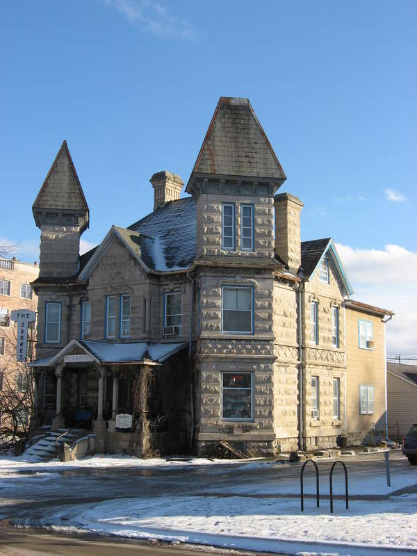 Front and western side of the Batman House (now The Garret Antiques), located at 403 W. Kirkwood Avenue in Bloomington, Indiana, United States.  Built in 1890, it is a part of the Bloomington West Side Historic District, a historic district that is