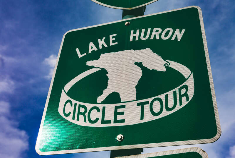 A sign for the Lake Huron Circle Tour along Ashmun Street in Sault Ste. Marie, Michigan.