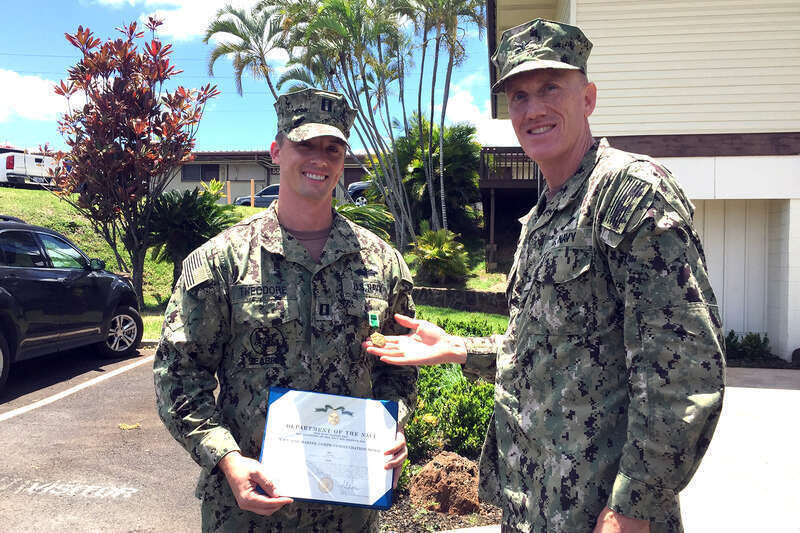 PEARL HARBOR-HICKAM, Hawaii (May 10, 2017) Naval Facilities Engineering Command (NAVFAC) Hawaii Commanding Officer Capt. Richard Hayes III presents a Navy and Marine Corps Commendation Medal to Lt. Benjamin W. Theodore May 10 at Joint Base Pearl