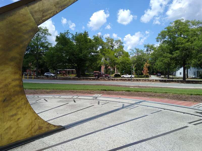 12:00 noon according to the sundial at Morehead Planetarium in Chapel Hill, North Carolina. According to the smartphone used to take the photo, it's 1:22pm.
Why the discrepancy? First, there's a correction based on the time of year (22 minutes in