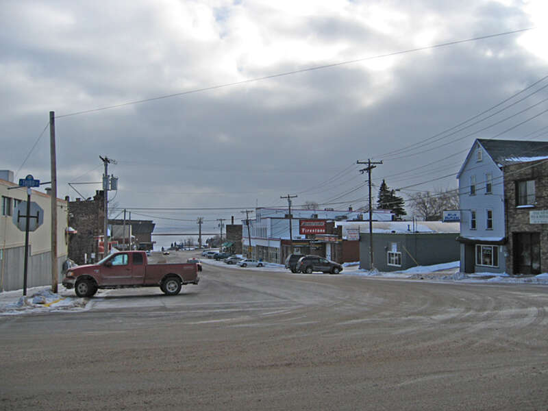 A winter view of Baraga looking toward the lake.  Short buildings and the lack of street trees fails to properly frame an over-wide street; creating a pedestrian unfriendly environment. 
This work is licensed under a 
Creative Commons Attribution 3.0