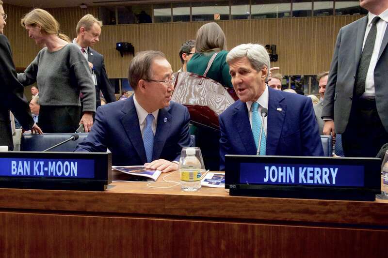 U.S. Secretary of State John Kerry chats with United Nations Secretary General Ban Ki-moon before delivering remarks at the “Battle for Zionism at the U.N.: Marking 40 Years Since the Historic Speech of President Chaim Herzog,” on November 11, 2015,