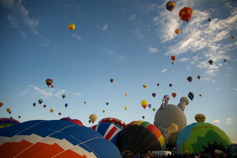 More balloons take to the sky, with more to come. Albuquerque International Balloon Fiesta, 2012. Over 750 ballons on site.