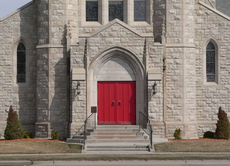 West (main) entrance of St. Mark's Episcopal Pro-Cathedral at 4th and Burlington in Hastings, Nebraska.  The building was designed in Late Gothic Revival style in 1919 by architect Ralph Adams Cram, and built over the course of the next decade; the