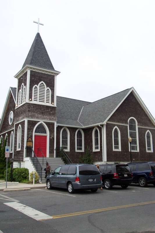 Parking lot view of St. Paul's by-the-sea Protestant Episcopal Church, located at 302 N. Baltimore Street in Ocean City, Maryland, United States.  Built in 1900, the Gothic Revival church is listed on the National Register of Historic Places.  Church