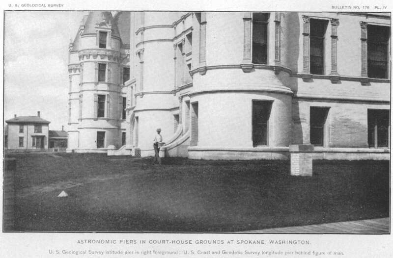 These stone monuments also known as astronomic piers next to the Spokane Courthouse cupola flagpole were used as base stations or benchmark reference points for latitude and longitude in the USGS &quot;Survey of the Boundary Line Between Idaho and Montana