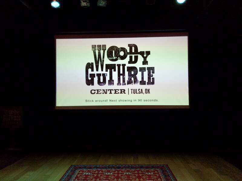 An approximately 15-minute-long introductory film about Woody Guthrie keeps showing in a theatre room near the entrance of the Woody Guthrie Center in Tulsa, Oklahoma.
