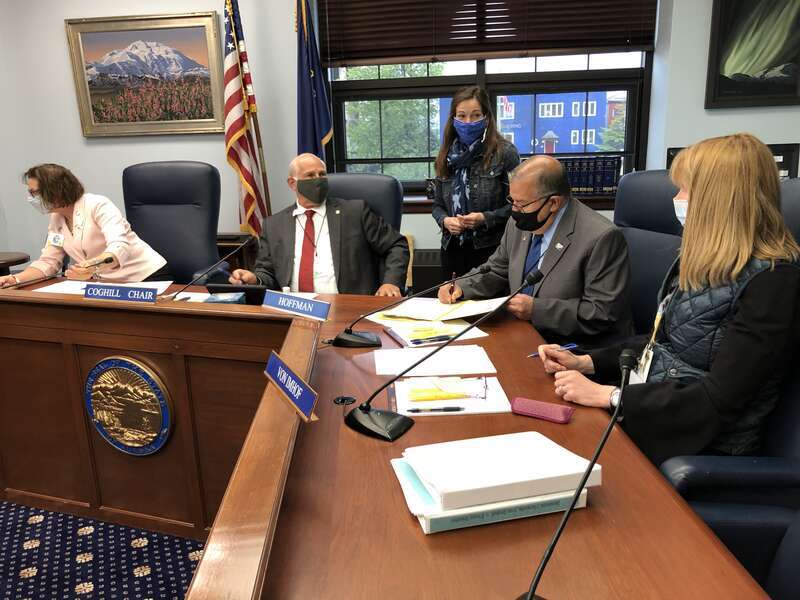 The Alaska Senate's Rules Committee is seen Tuesday, May 19, 2020 in the Alaska State Capitol as it signs a bill ratifying Gov. Mike Dunleavy's plan to spend CARES Act coronavirus funding. (James Brooks photo)