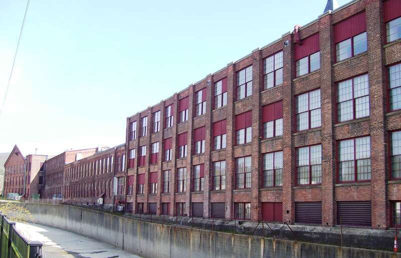 The buildings of the Arnold Print Works (now MASS MoCA) as seen from River Street in North Adams, Massachusetts.