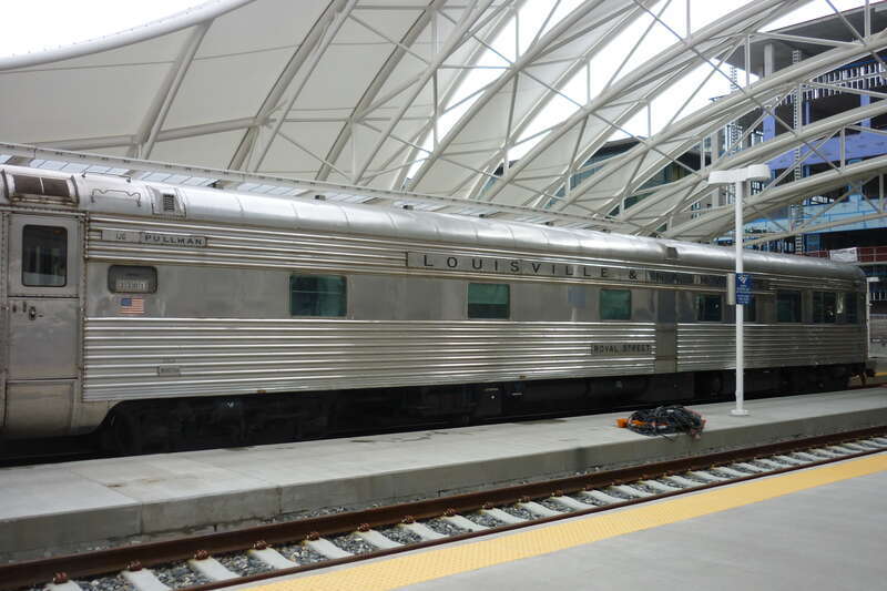 Denver - private cars bring glamor to Union Station. New hotel is under construction at stub end of tracks.